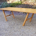 Oak dining table with steel supports